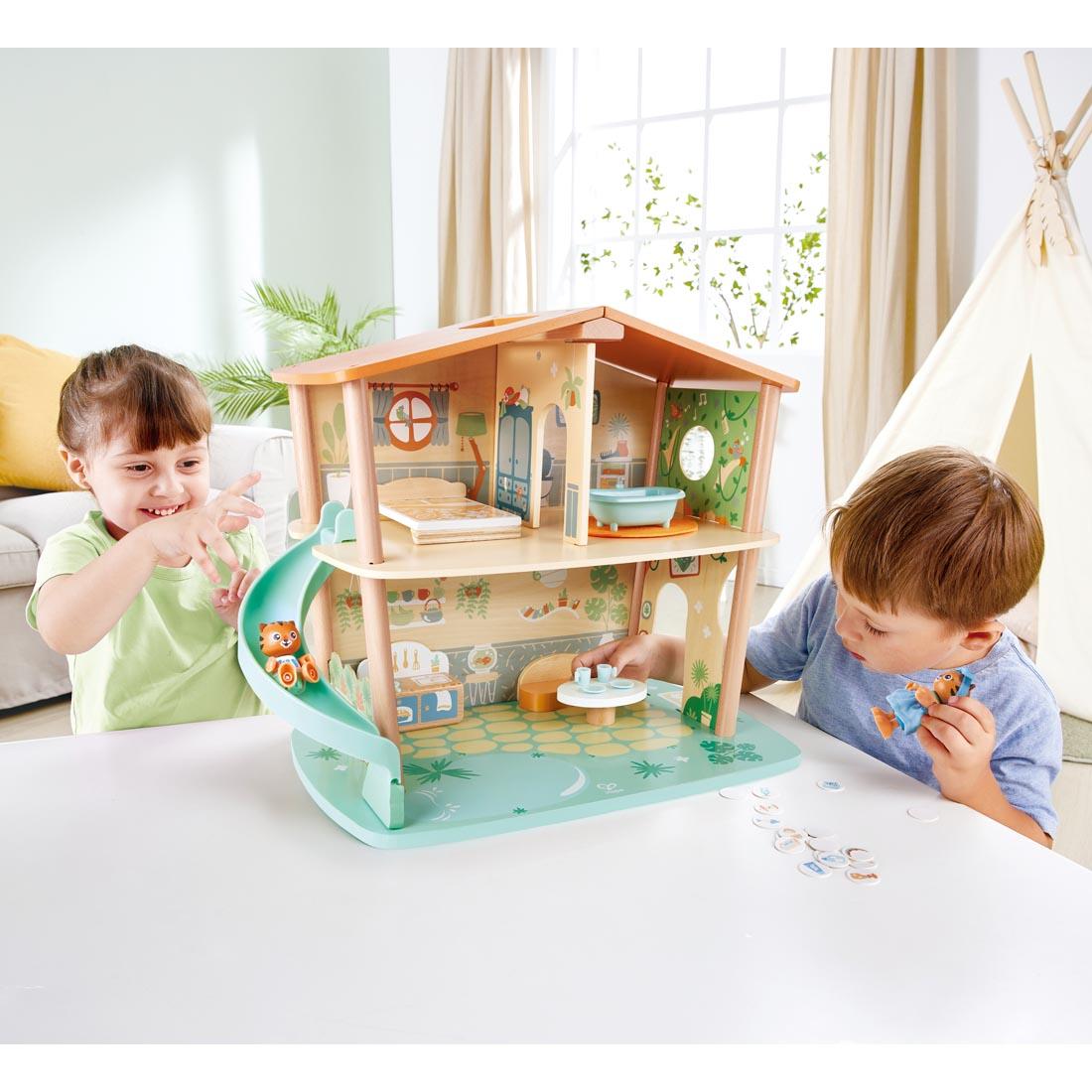 two children playing with the Tigers' Jungle House By Hape