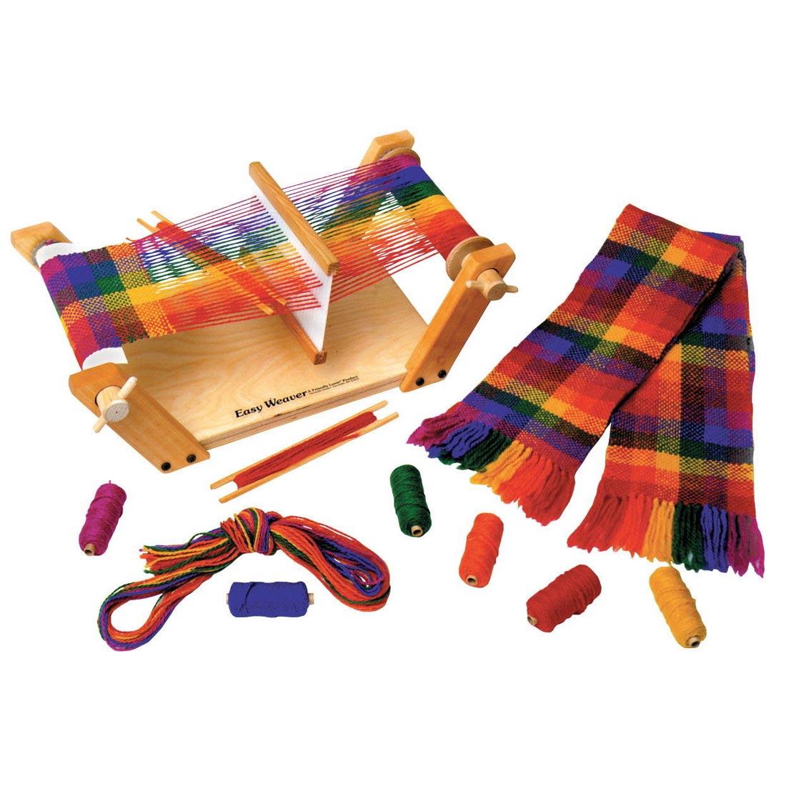 Friendly Loom Easy Weaver Loom shown with contents of the kit and a completed scarf