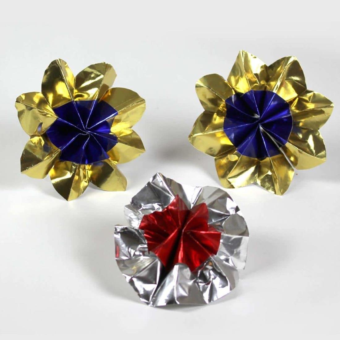 3 paper flowers made wtih different colors of Metallic Foil Paper