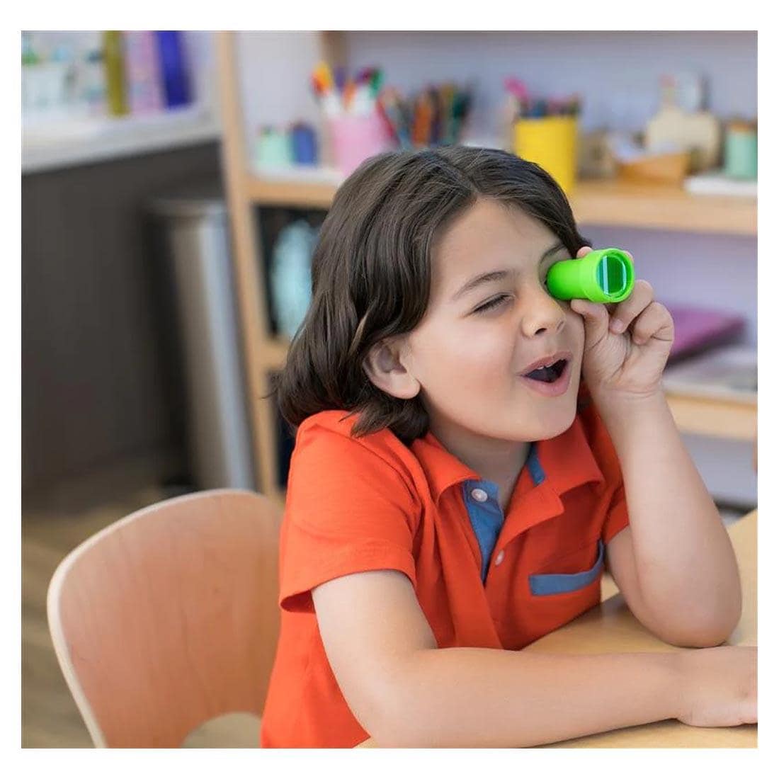 Child using an Insect Lore Bug Eyes viewer