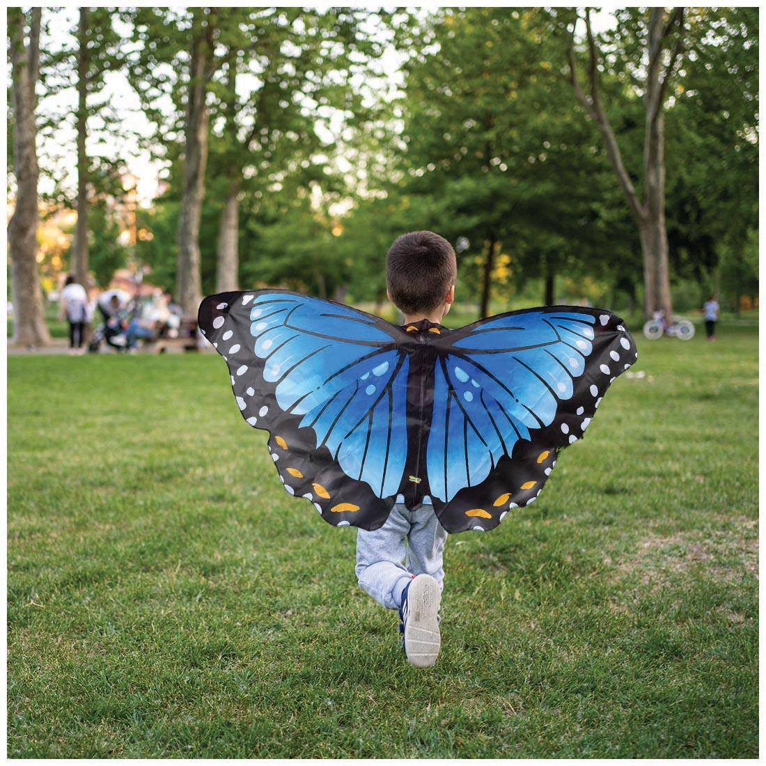 child outside wearing the Dress Up Blue Morpho Butterfly Wings by Insect Lore
