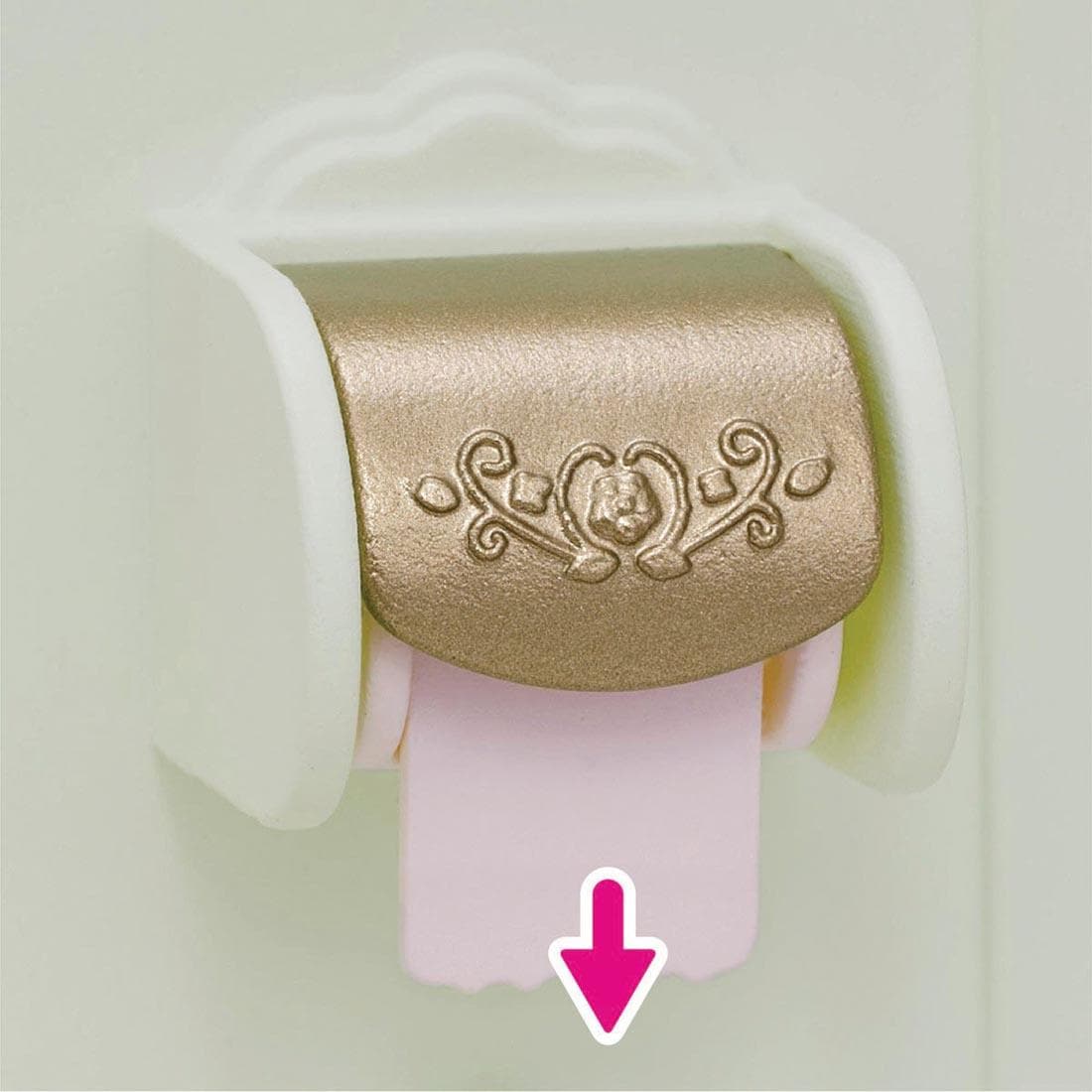 closeup of the toilet paper roll from the Calico Critters Toilet Set with an arrow to show action