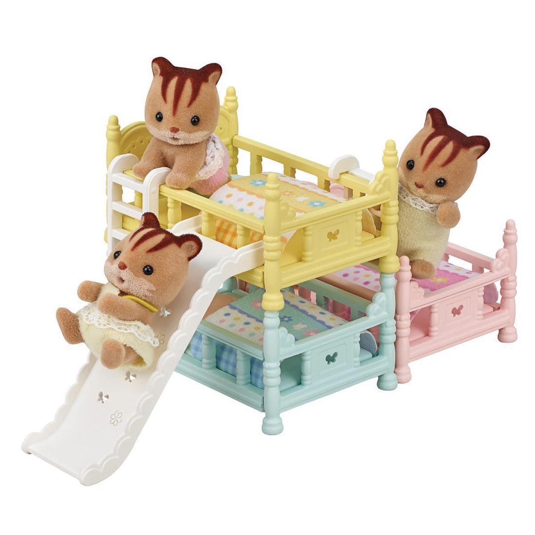 three critters using the Calico Critters Triple Bunk Beds