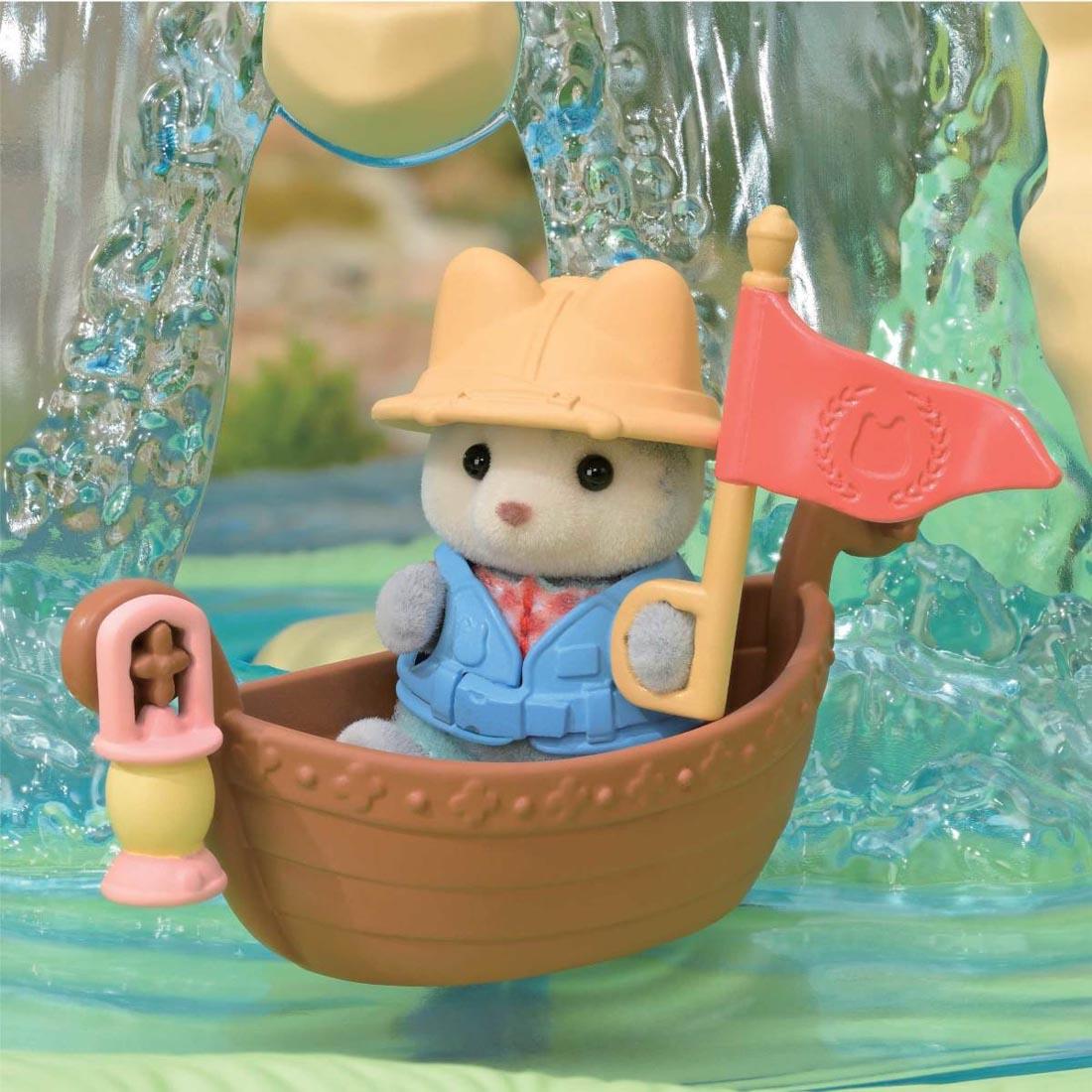 Linnea in her boat with lantern and flag from the Calico Critters Secret Forest Falls set
