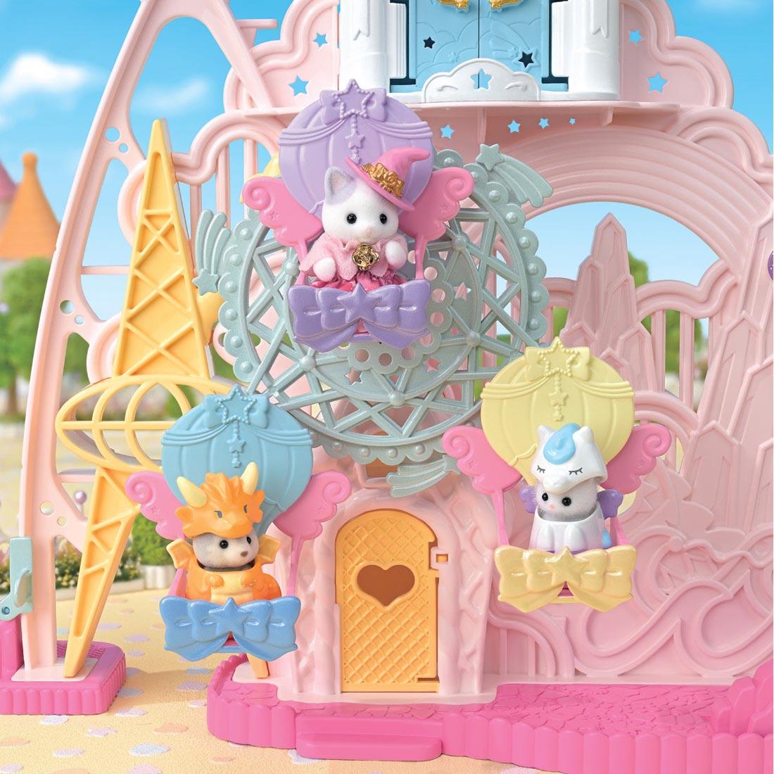 3 critters using the Calico Critters Baby Dream Amusement Park
