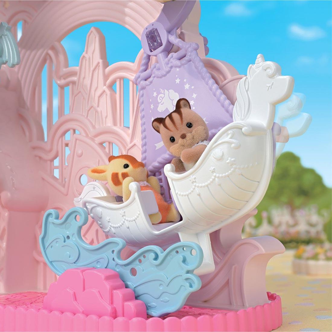 2 critters using the Calico Critters Baby Dream Amusement Park
