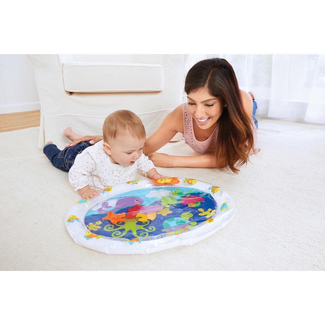 baby and adult laying on floor looking at the Pat 'n Laugh Water Mat by Kidoozie