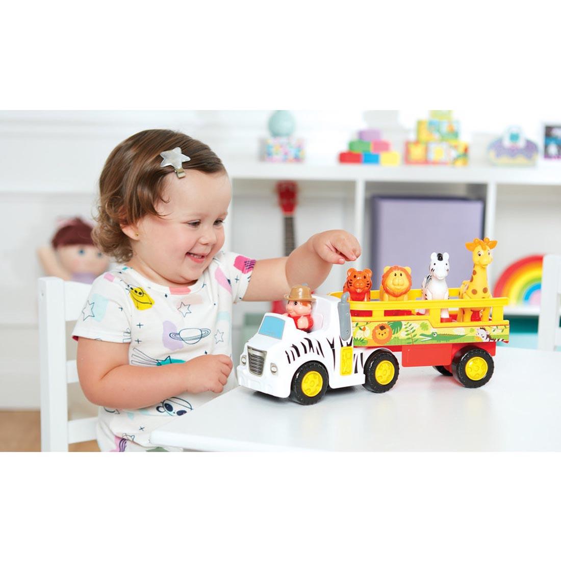 child playing with the Animal Adventure Truck By Kidoozie