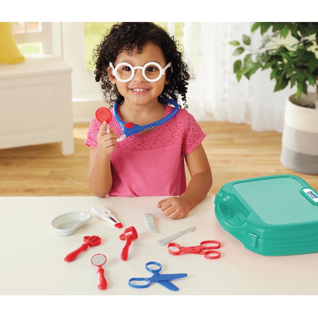 child playing with the pieces from My First Doctor's Kit By Kidoozie