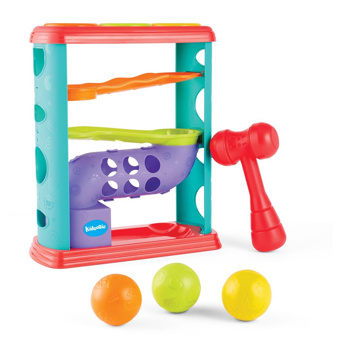 Pound-A-Ball Tower By Kidoozie, with the hammer on the side and 3 balls on the ground in front