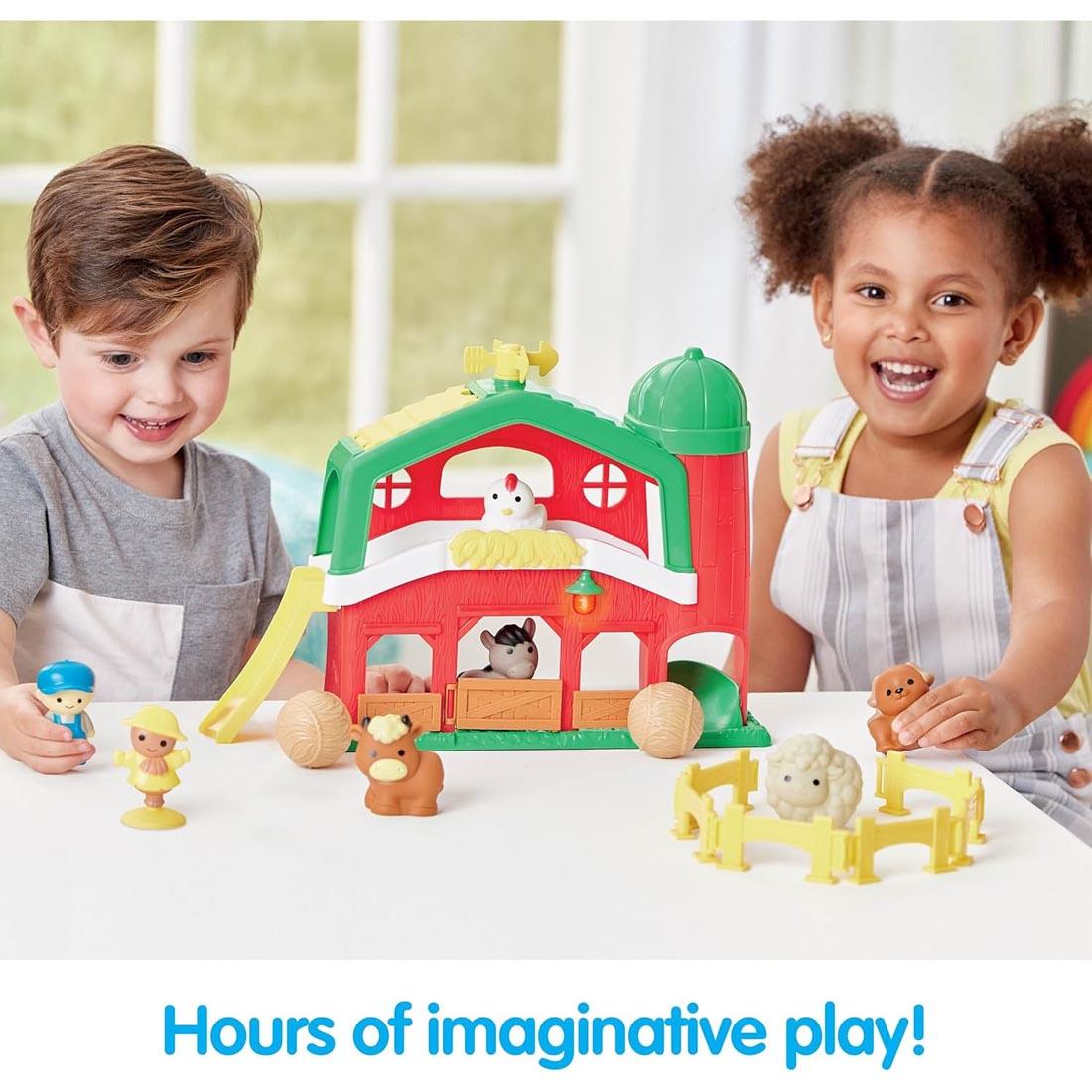 2 kids playing with the Barnyard Farm Playset By Kidoozie plus text Hours of imaginative play!