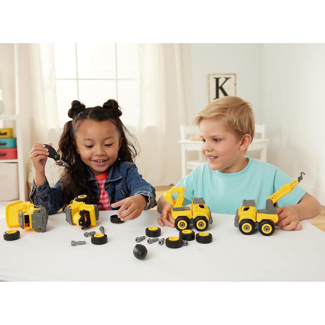 2 kids playing with the Tool Time Truck Set By Kidoozie