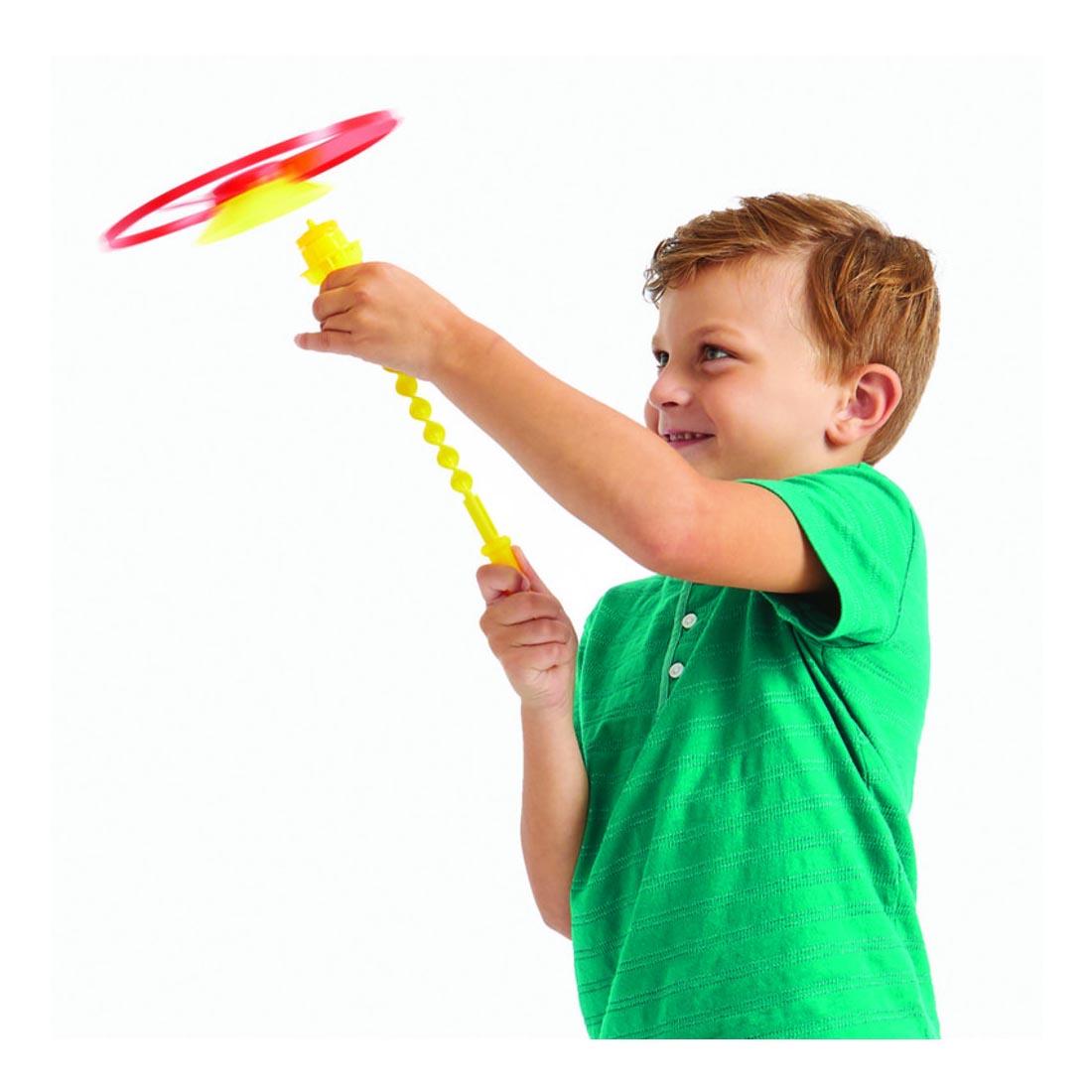 child launching the Sky Spinner by Game Zone