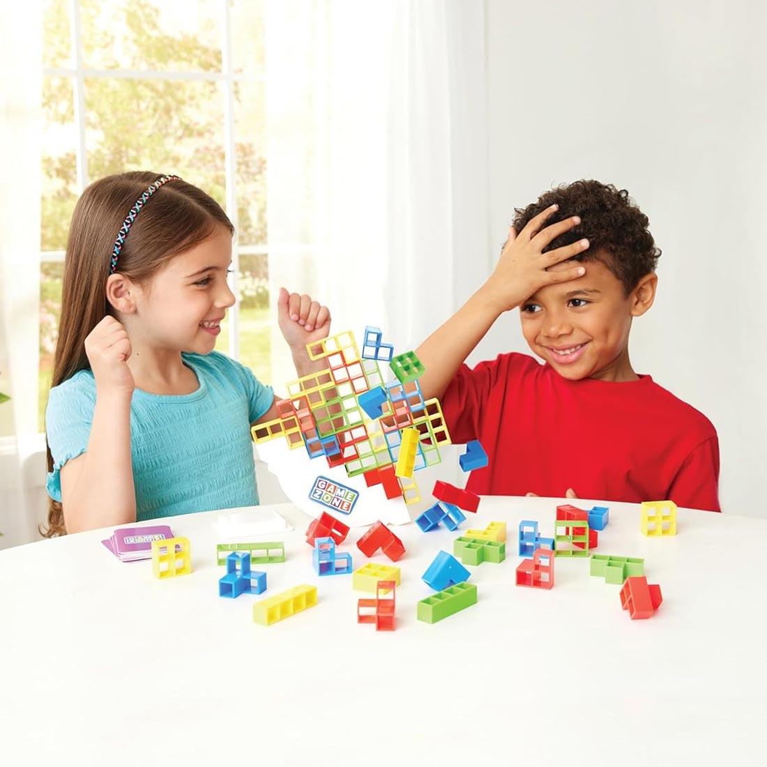 2 kids playing the Stack Attack Game