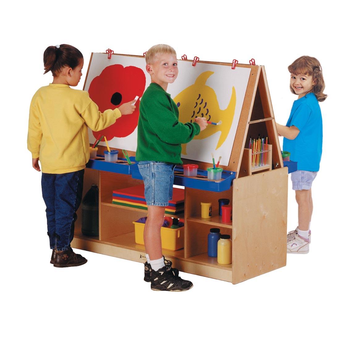 children making art at the Four-Station Easel