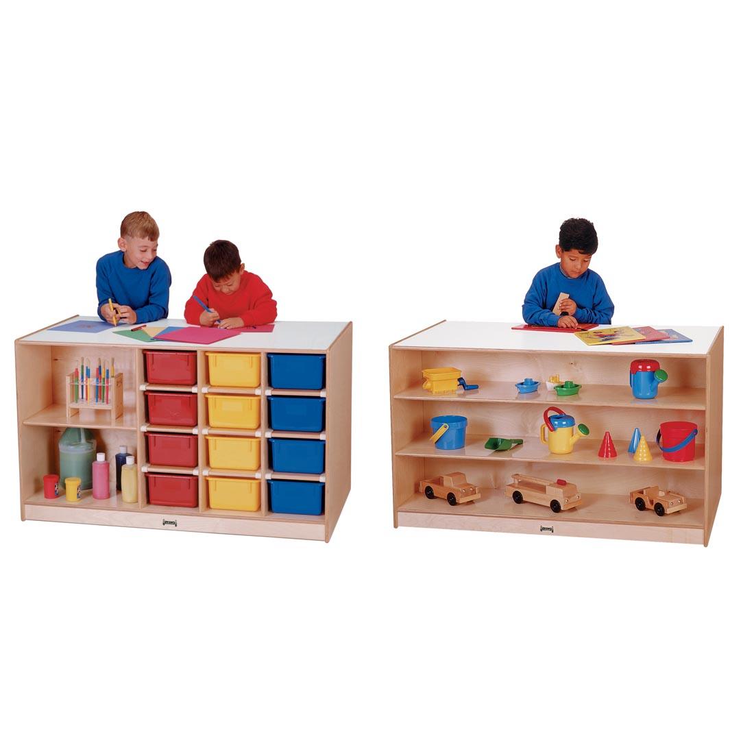 Children working on the countertops of the Mobile Storage Island With Colored Trays; both front and back sides are shown