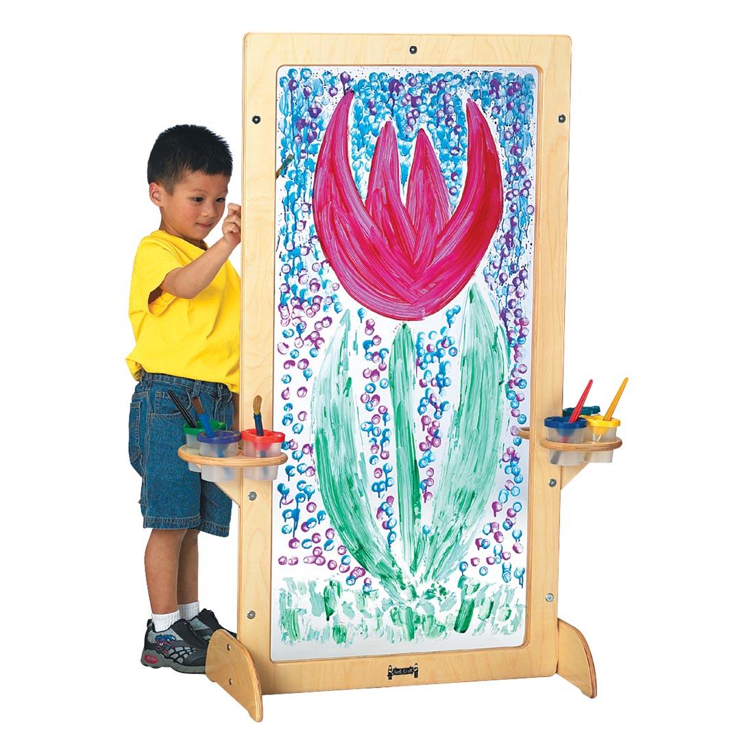 Child painting on the See-Thru Easel