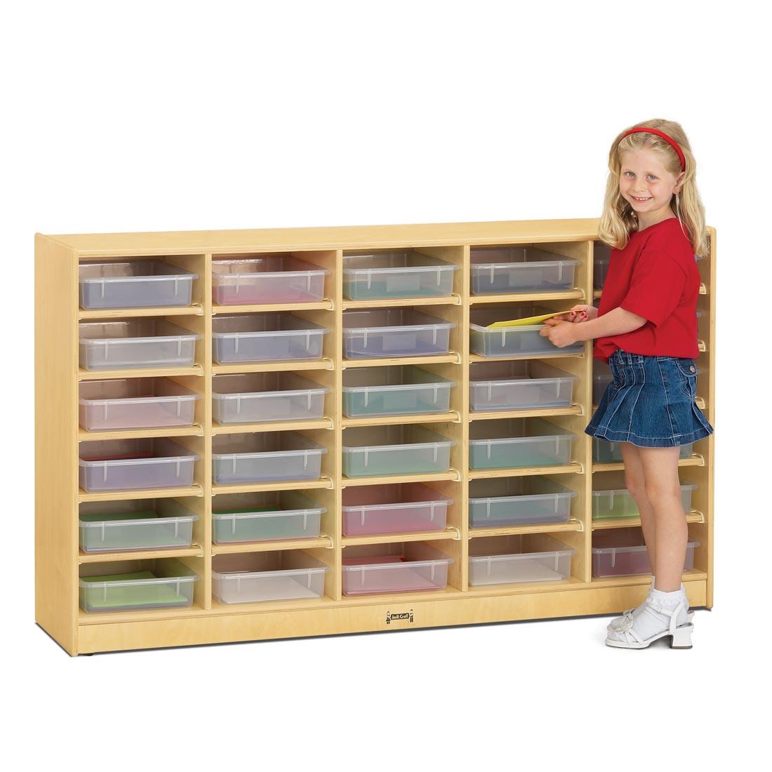 Child standing in front of the 30 Paper-Tray Mobile Storage With Clear Trays