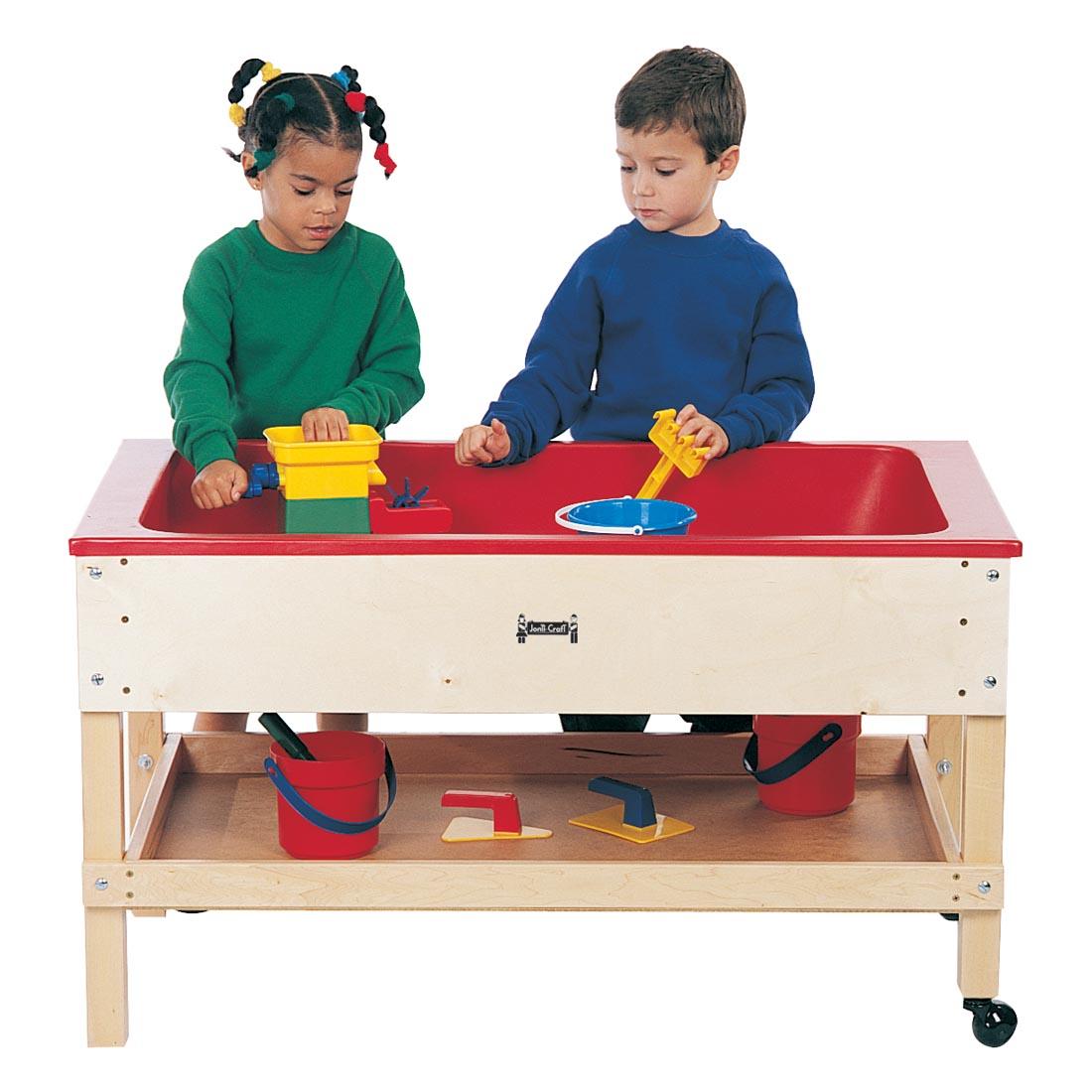 Two children playing at the Sensory Table With Shelf