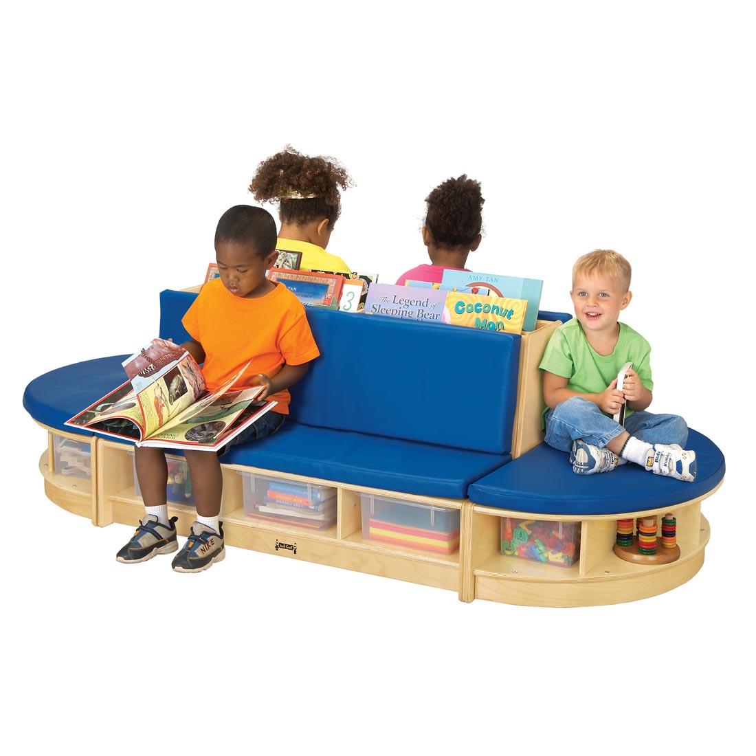 Children with books sitting on the Read-A-Round With Blue Cushions