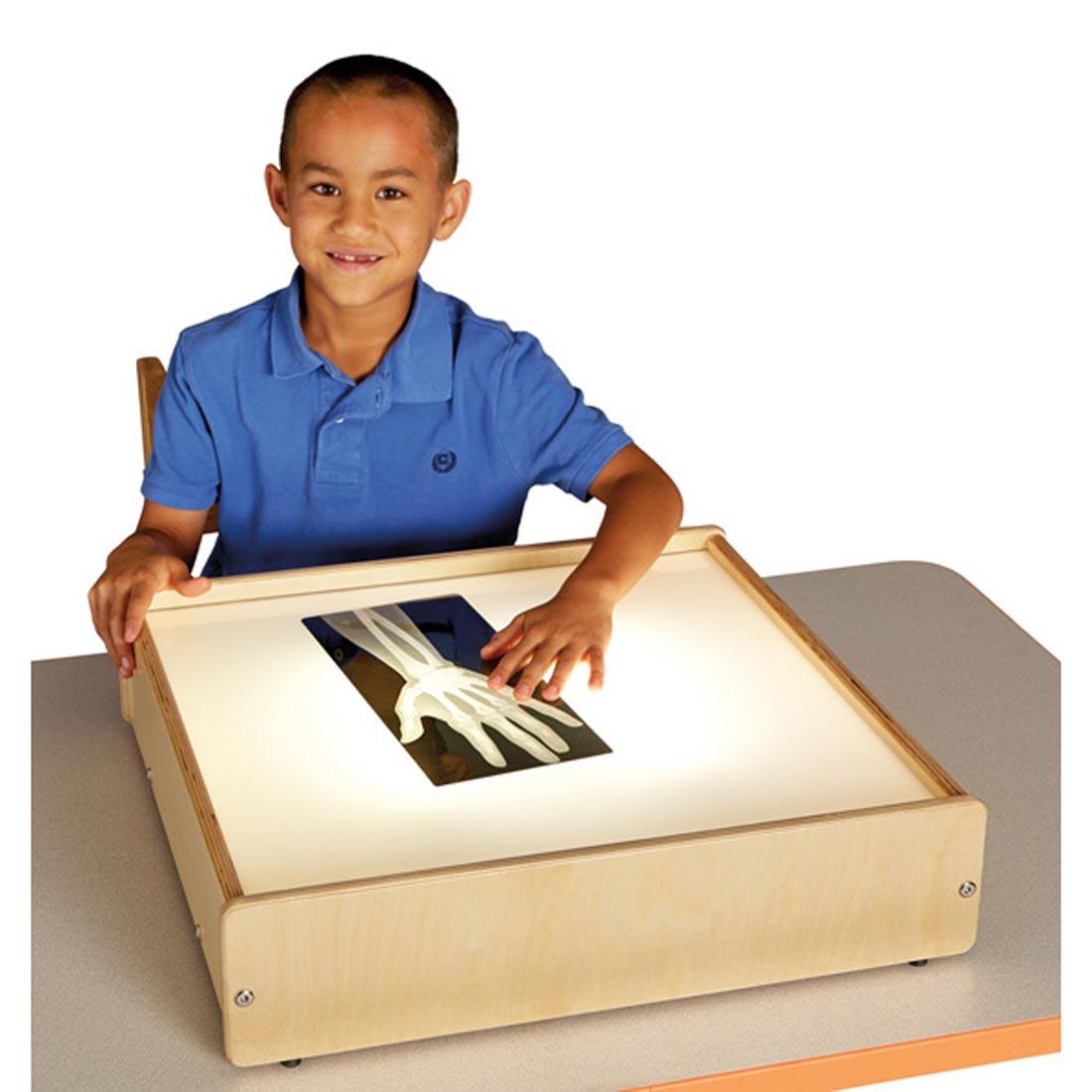 Child with an X-ray on the Tabletop Light Box