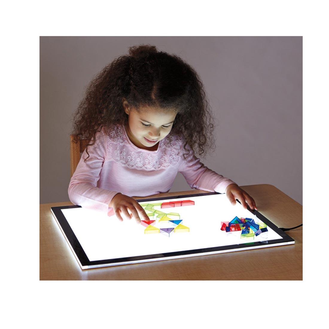 Child using the Jonti-Craft Illumination Light Tablet