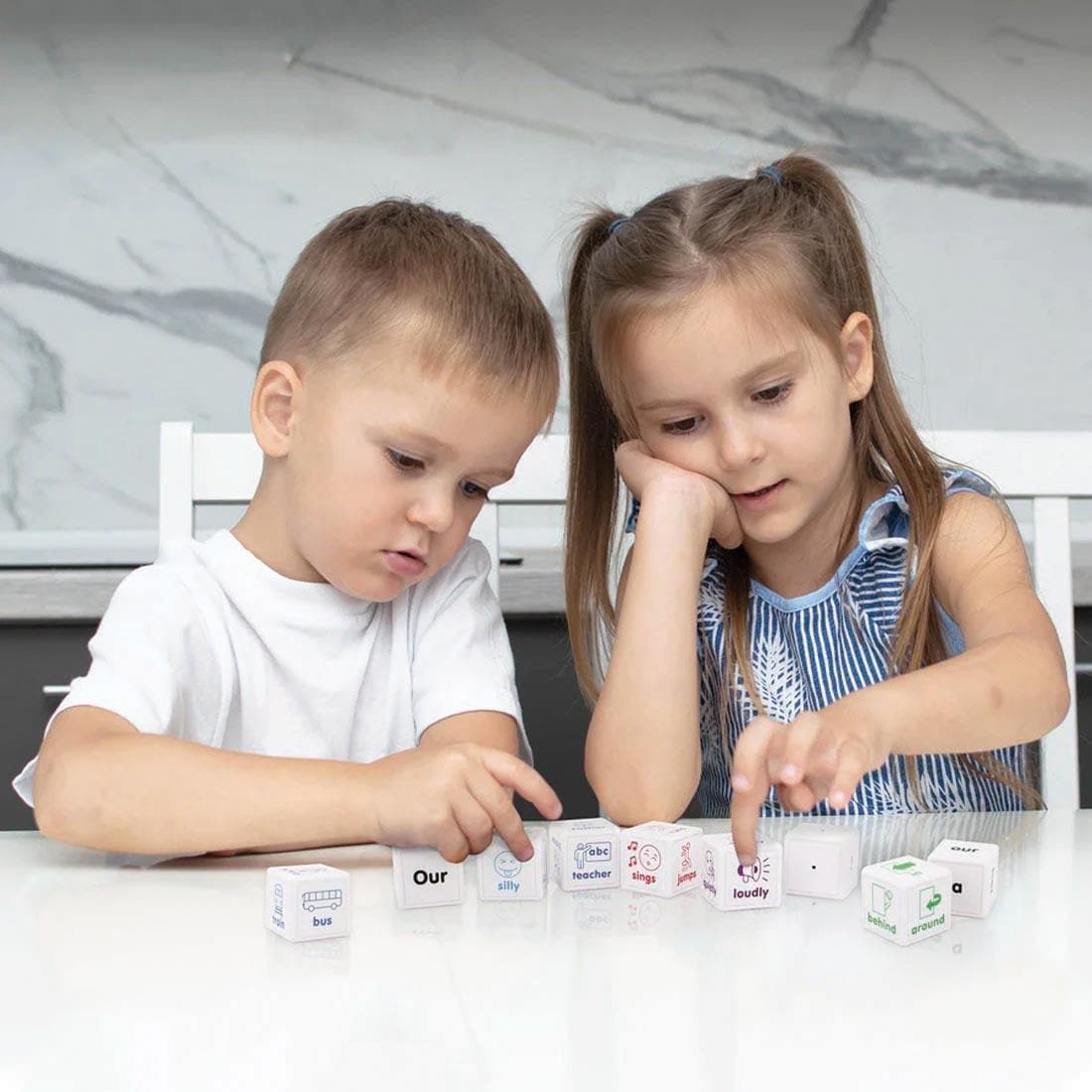 Two children playing with Sentence Cubes By Junior Learning