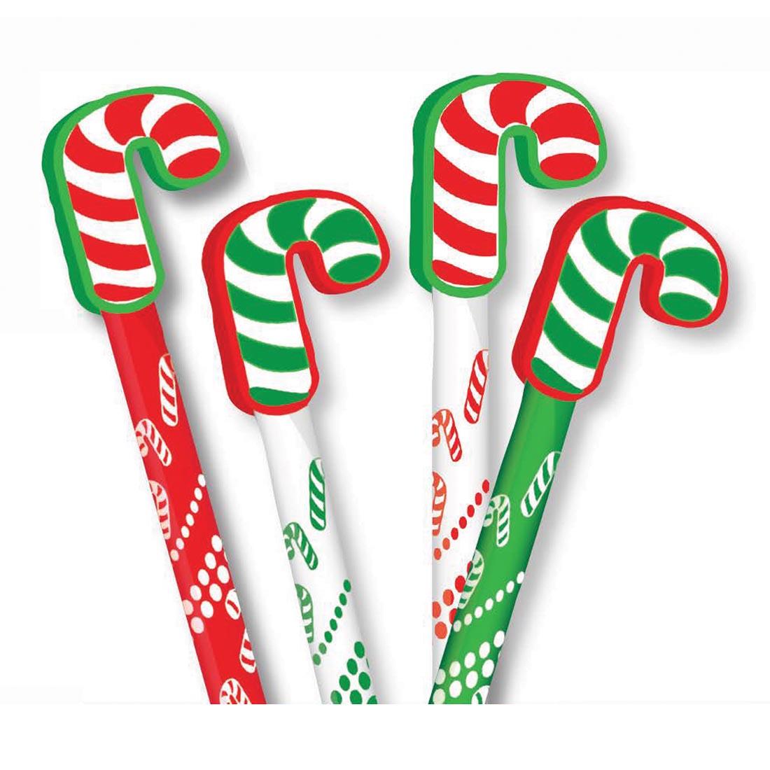 Red, white and green pencil topper erasers shaped like candy canes, shown on the tops of pencils