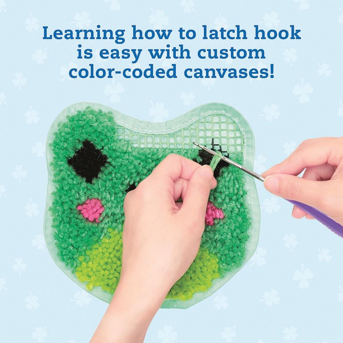 hands using Latch Hook Animals Book and Creative Kit By Klutz Press plus text Learning how to latch hook is easy with custom color-coded canvases!