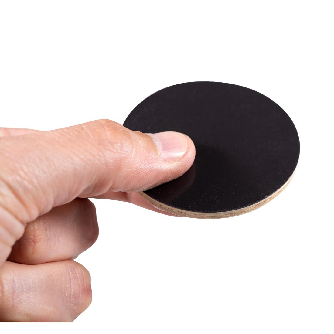 hand holding up the magnet side of a Emotions Wooden Magnet