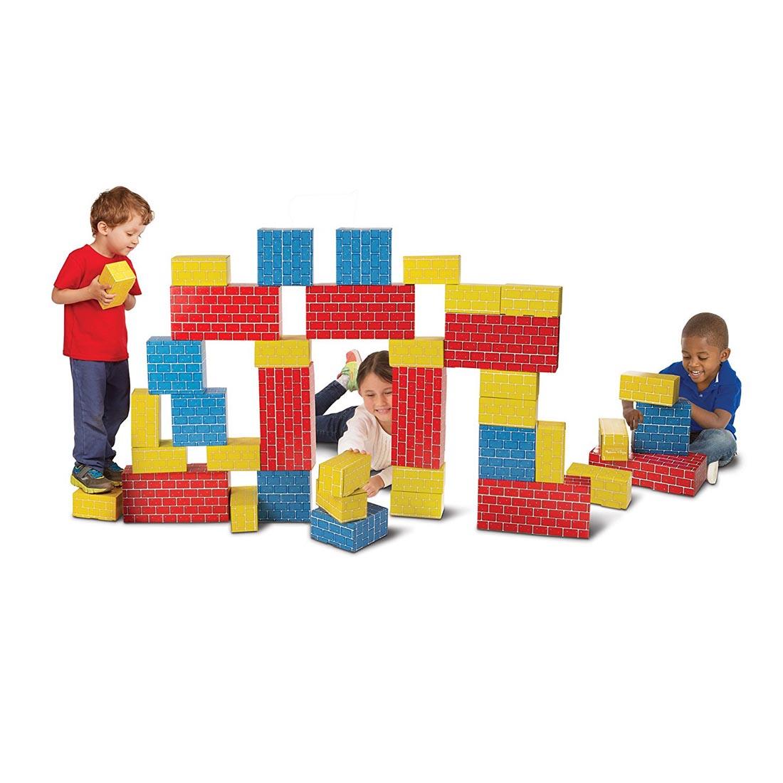 Children stacking Deluxe Jumbo Cardboard Blocks