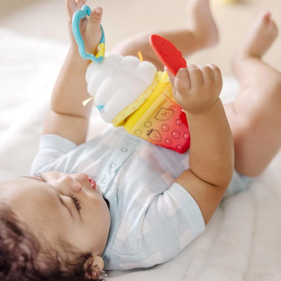 Baby playing with the Bubble Tea Take-Along Toy By Melissa & Doug