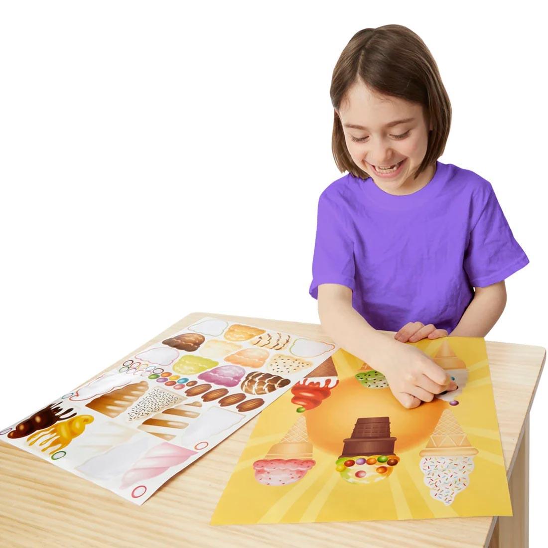 child using the Sweets & Treats Sticker Pad By Melissa & Doug