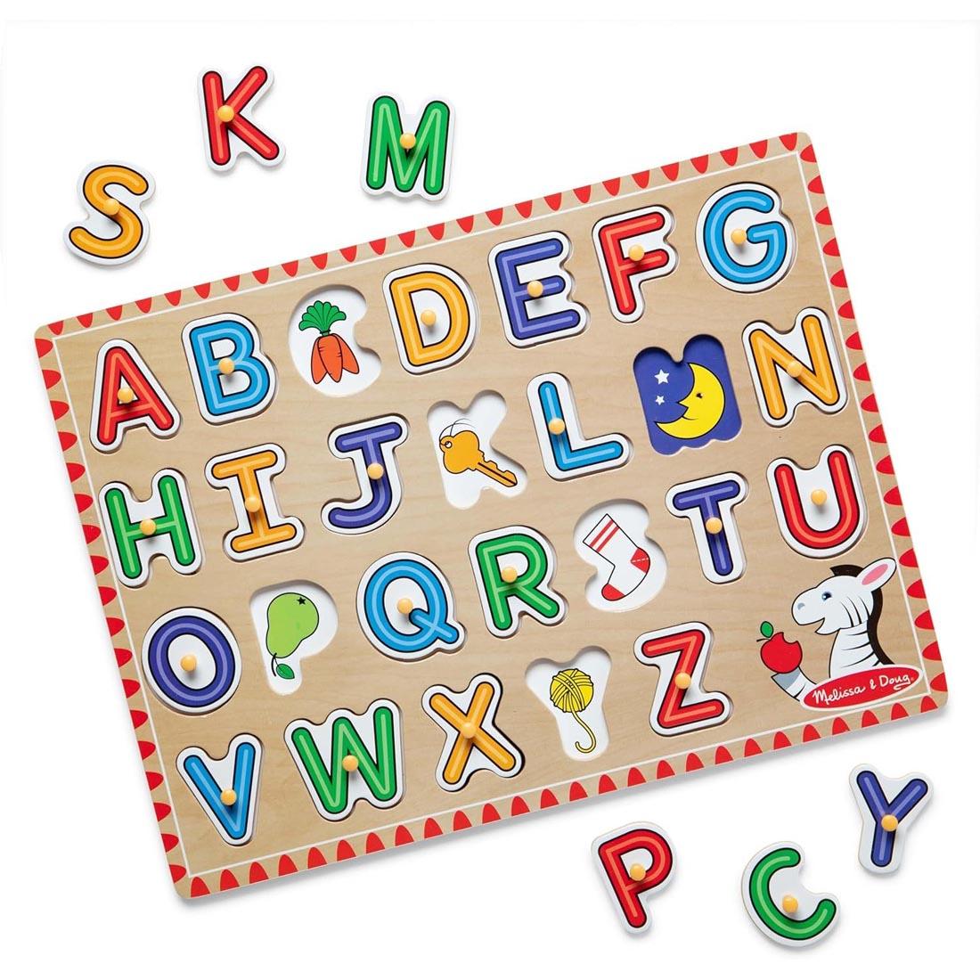 Lift & See Alphabet Peg Puzzle, with 6 letters removed from the puzzle, laying outside the frame