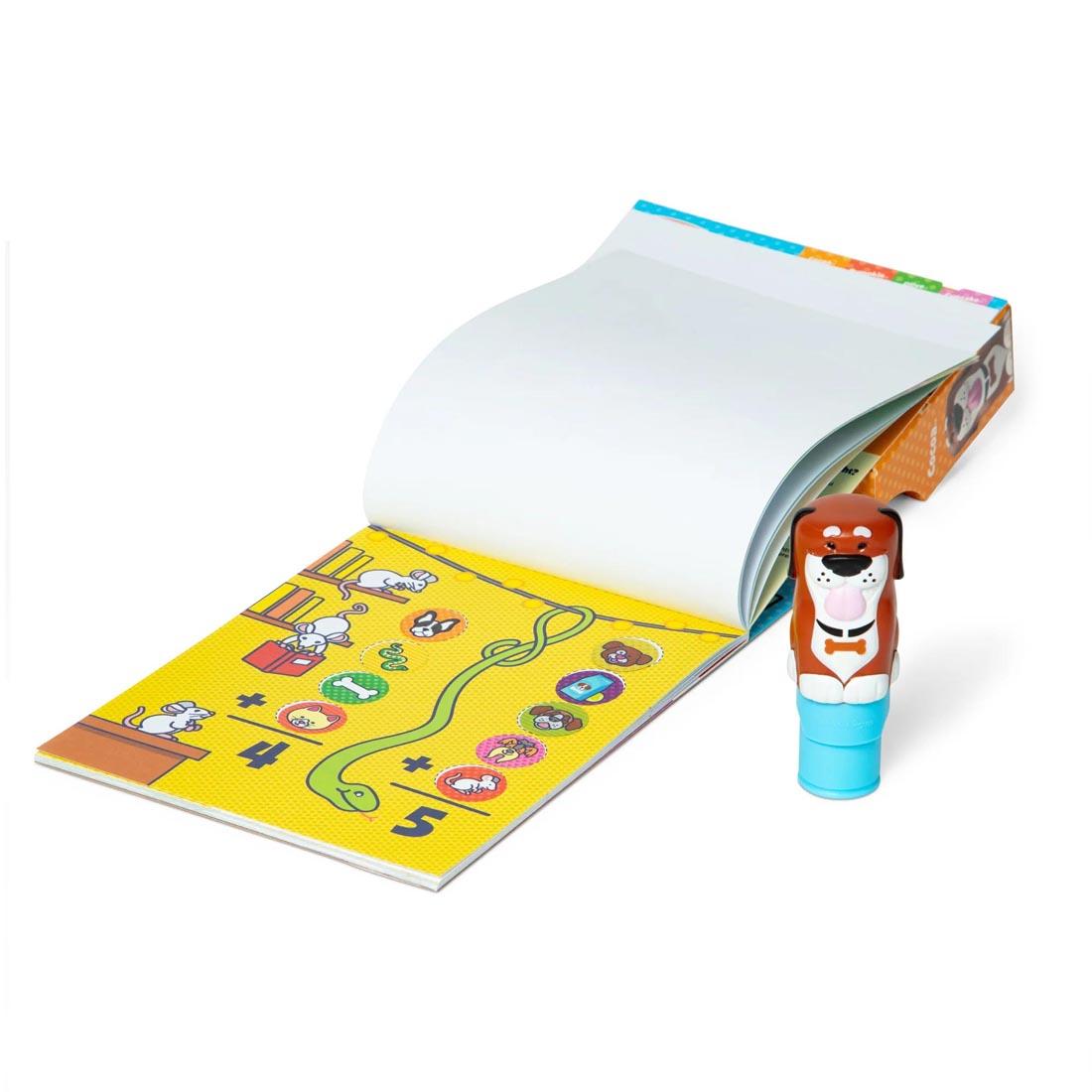 stamper and open book from the Dog Sticker Wow! Set By Melissa & Doug