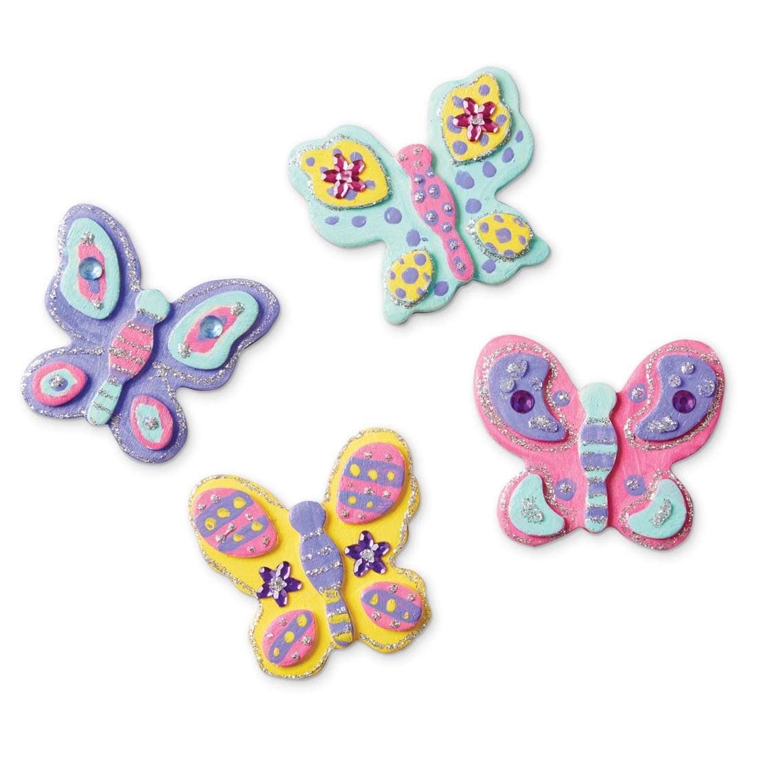 4 examples of completed projects from Created by Me! Butterfly Magnets Wooden Craft Kit By Melissa & Doug