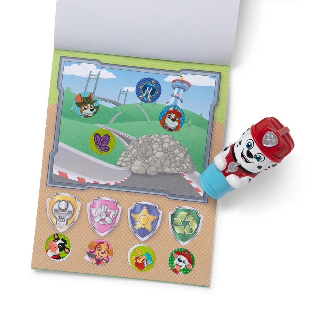 Paw Patrol Marshall Sticker Wow! stamper, plus open activity book with several round stickers applied