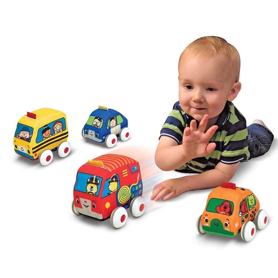 child playing with the Pull-Back Vehicles Set