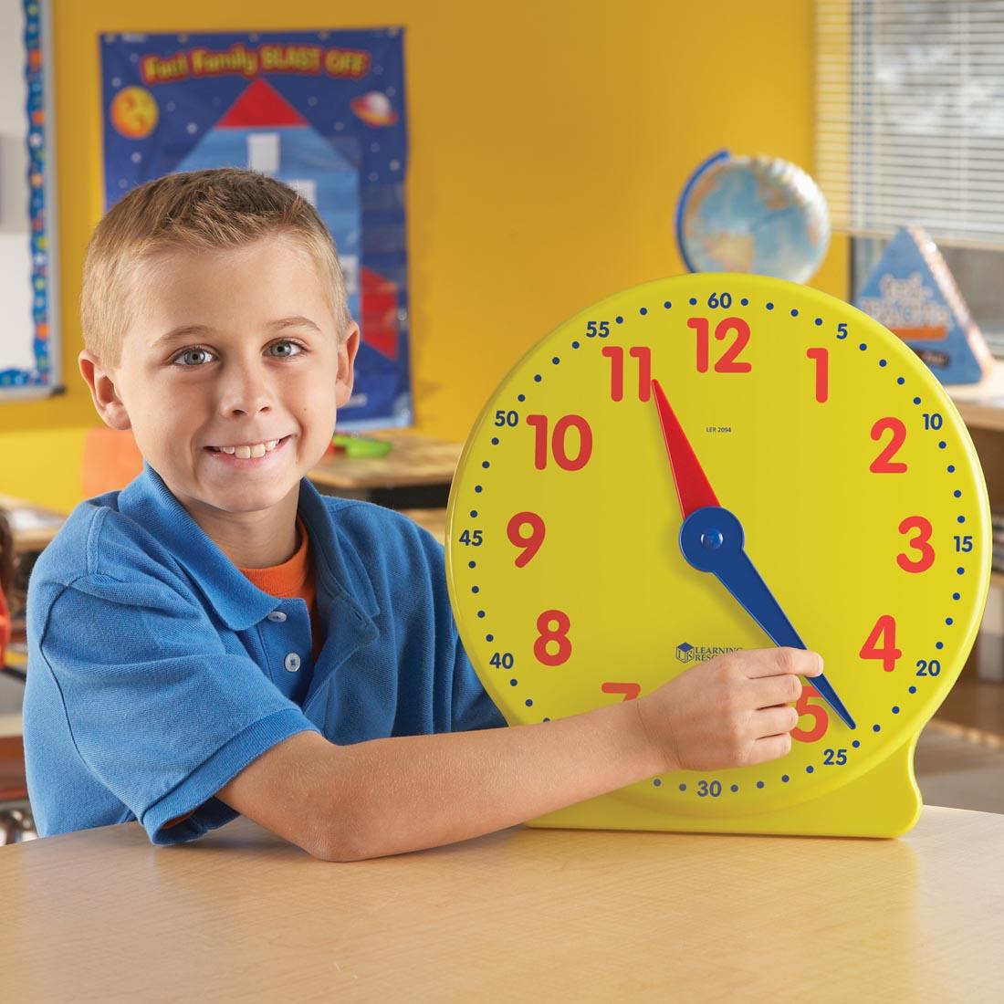 child using the Big Time Demonstration Clock By Learning Resources