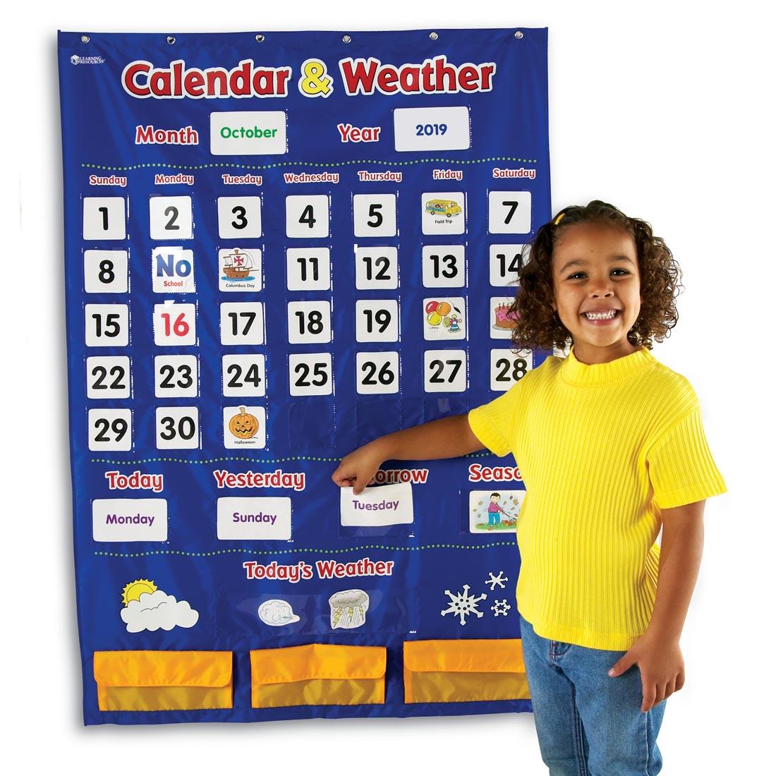 Calendar & Weather Pocket Chart By Learning Resource, with girl putting in a card