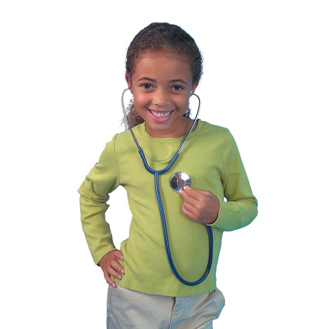 Child wearing Stethoscope By Learning Resources and listening to her own heart