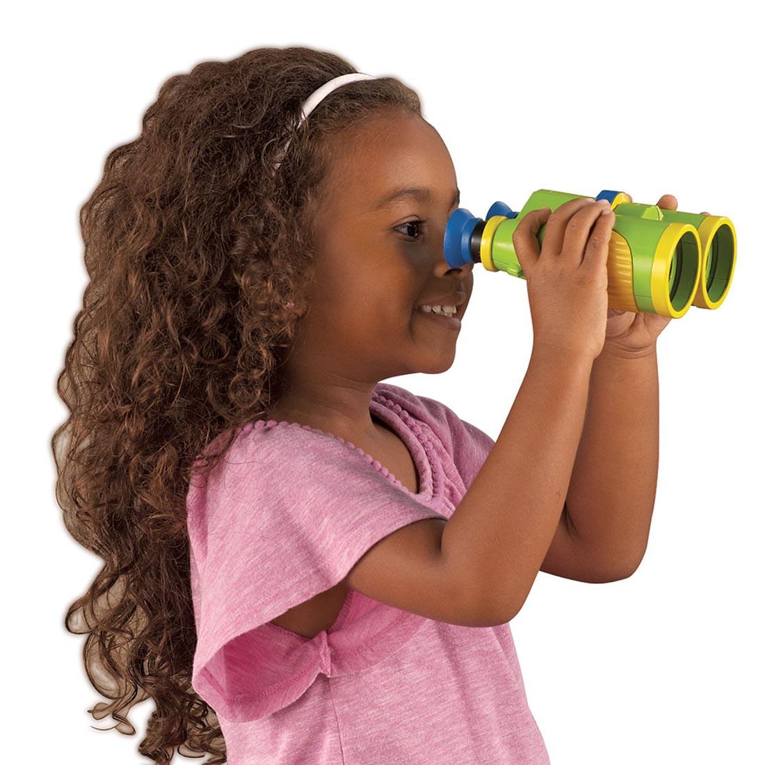 child looking through the Primary Science Big View Binoculars By Learning Resources