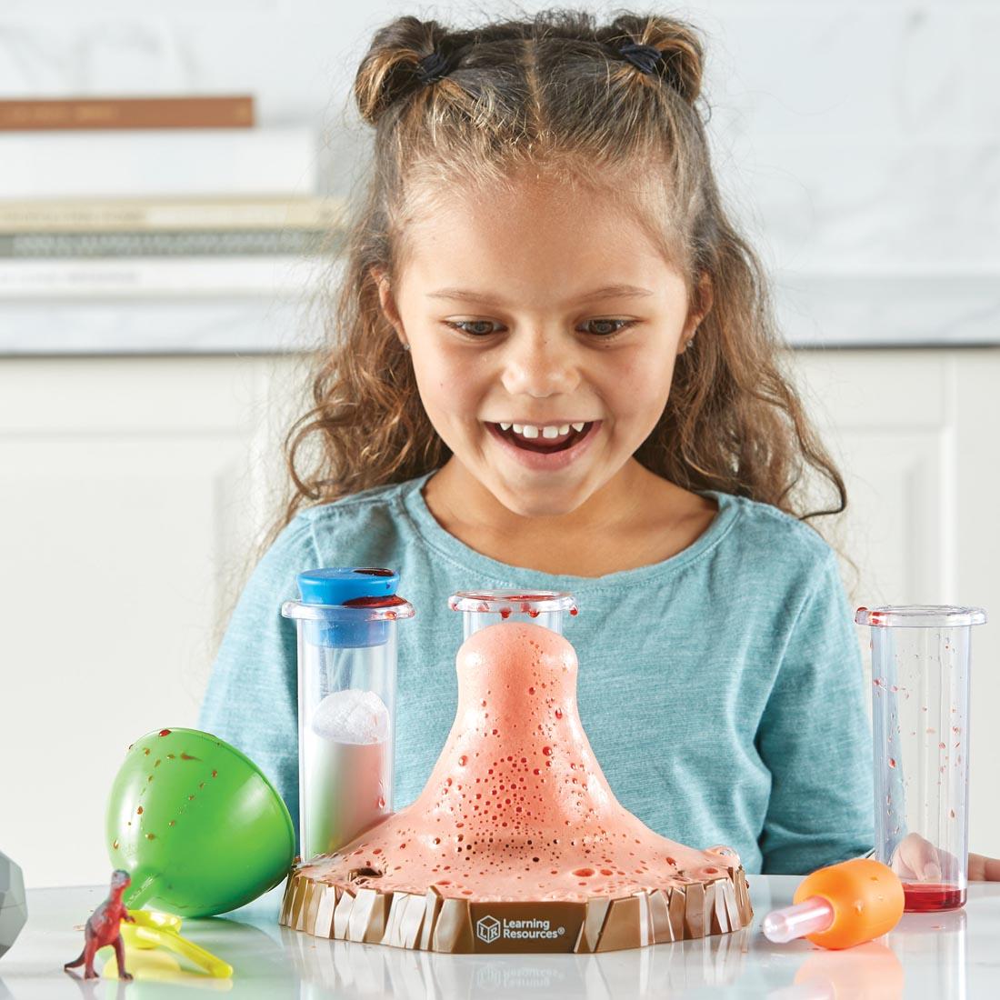 child playing with the Fizzy Volcano Preschool Science Lab