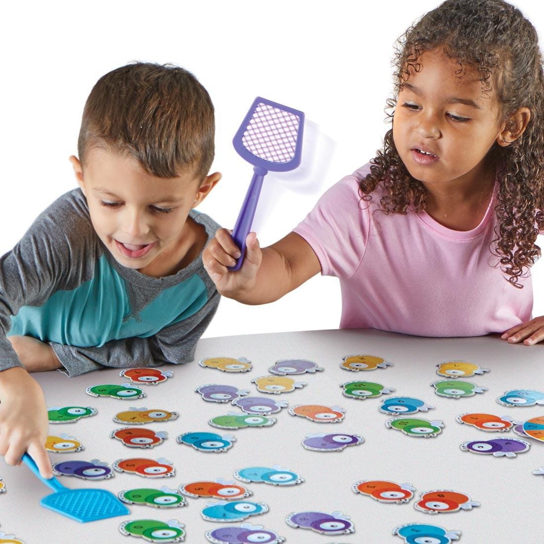Two children playing Math Swatters! Addition & Subtraction Game