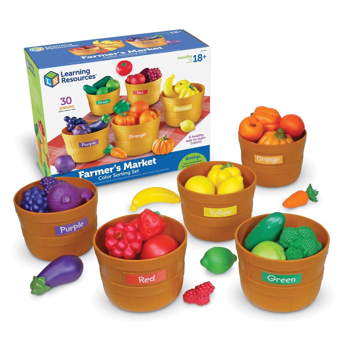 sorting set with colorful plastic fruits and vegetables in baskets, with packaging shown in background