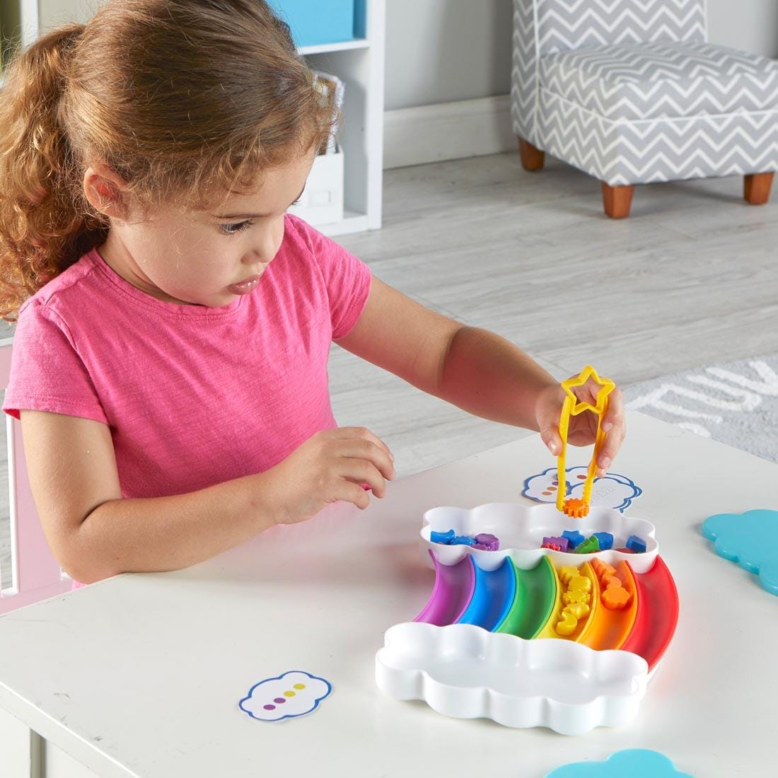 child playing with the Rainbow Sorting Set By Learning Resources