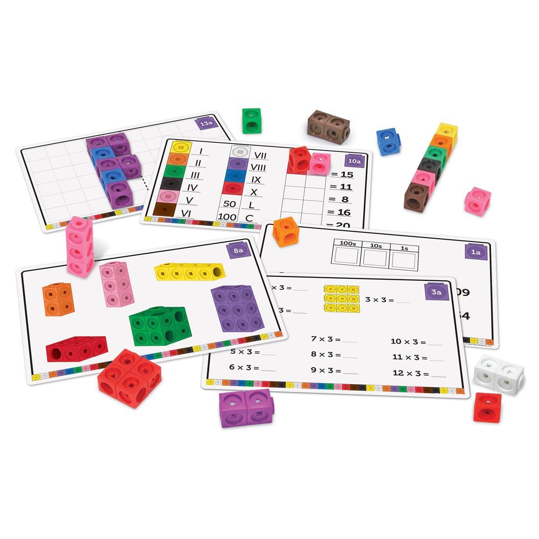 5 activity cards and several cubes from MathLink Cubes Elementary Math Activity Set By Learning Resources