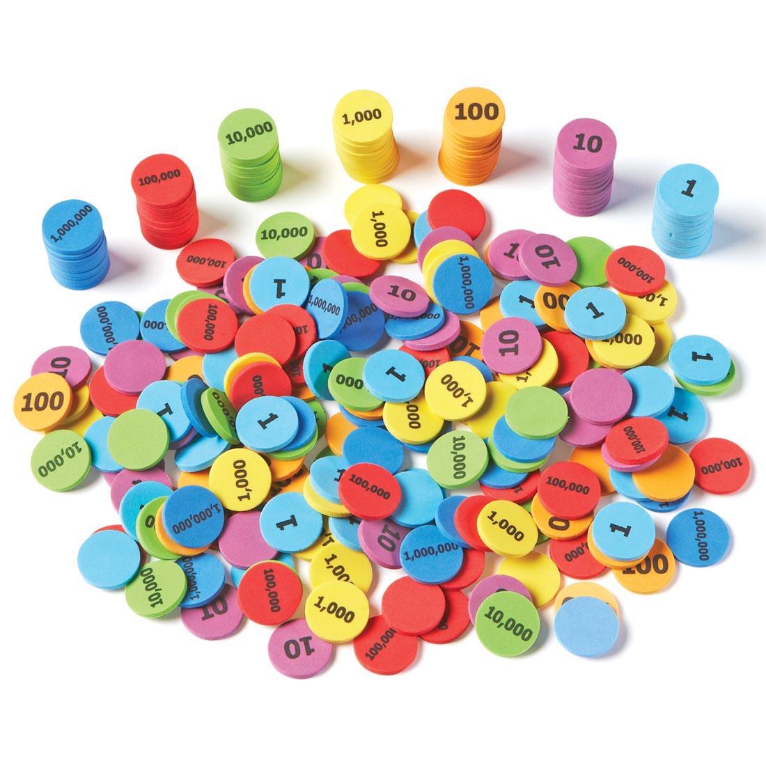 Place Value Disks Set By Learning Resources, some disks in stacks and the rest in a large pile