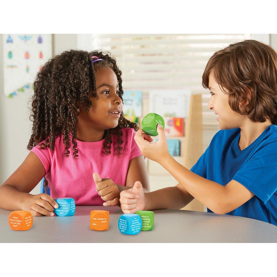 children reading the choices on Let's Talk Cubes