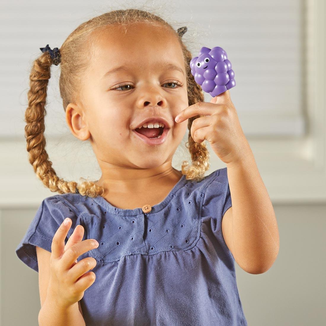 child playing with Big Feelings Nesting Fruit Friends
